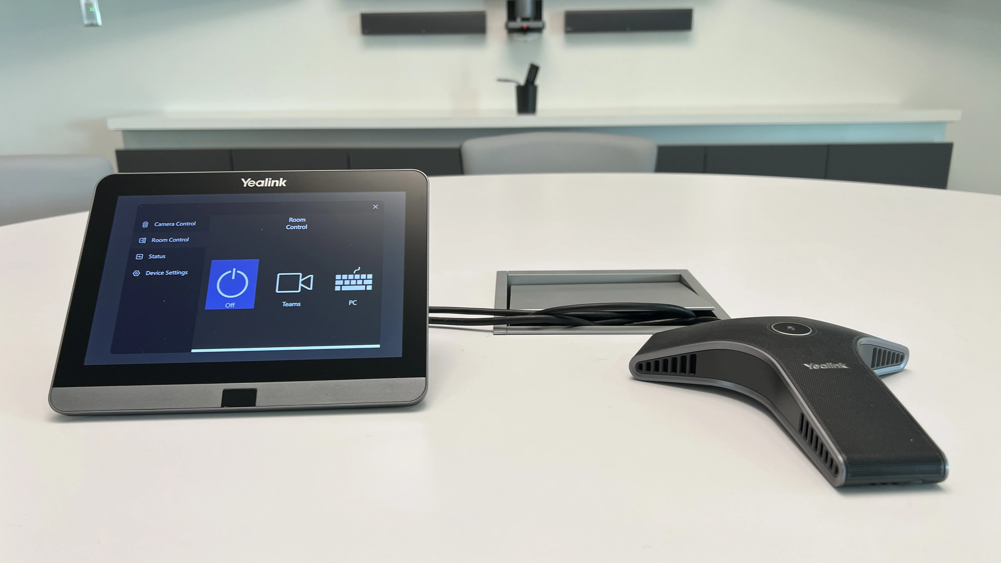 Yealink touch controller and tabletop speakerphone in a corporate meeting room